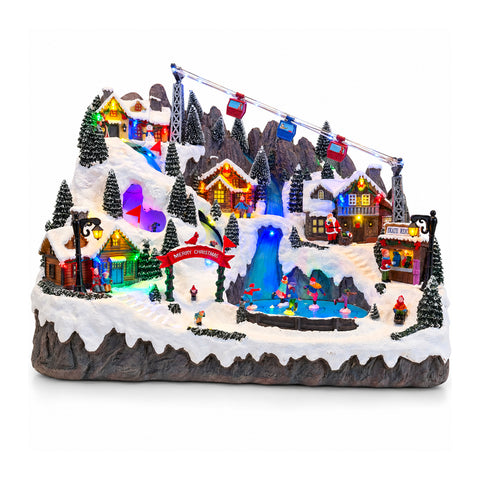 Beleuchtetes Weihnachtsdorf mit beweglichen Ski- und Schlittschuhbahnen, LED-Lichtern und Musik – 56x37x42 cm