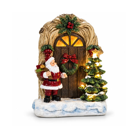 Leuchtender batteriebetriebener Weihnachtsmann mit Tür und Bäumchen, H19 cm